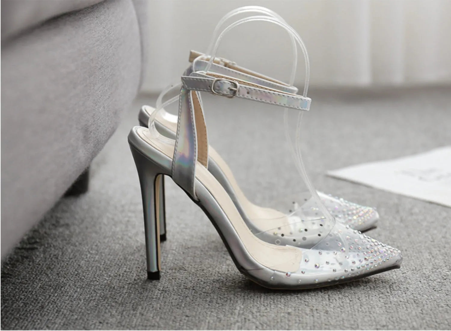Women's pointed toe diamond sandals with a stiletto heel, showing PVC upper material.