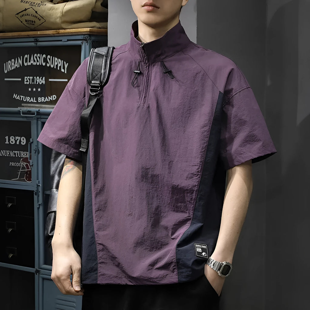 Brown men's loose-fit T-shirt with a half-zip stand collar and short sleeves.