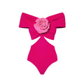 Women's one-piece swimsuit with hollow-out floral pattern and a matching wrap skirt laid flat.