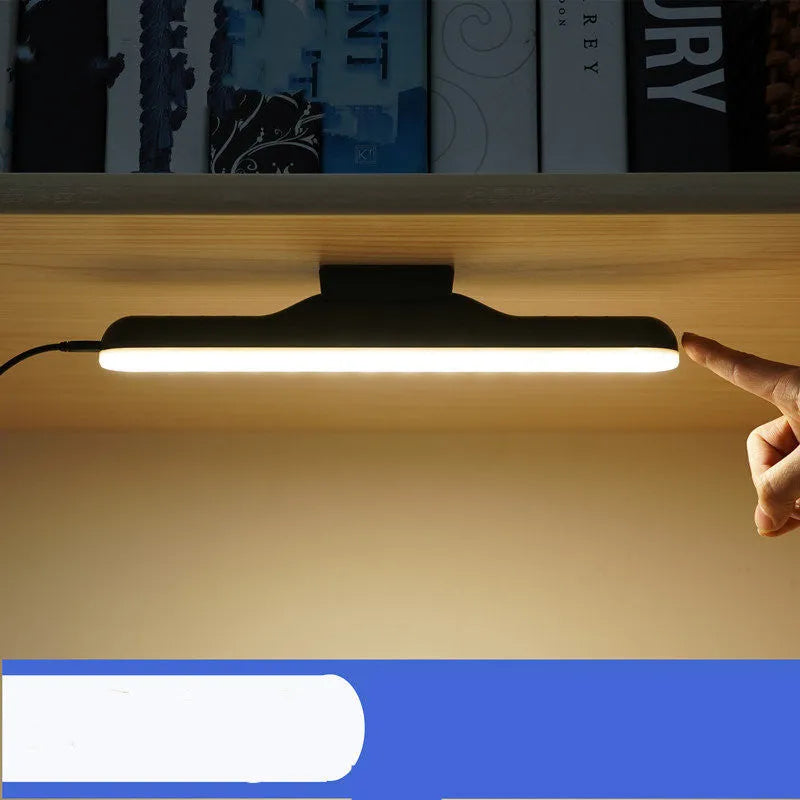 Modern simple desk lamp with touch controls and adjustable LED lighting on wooden desk surface