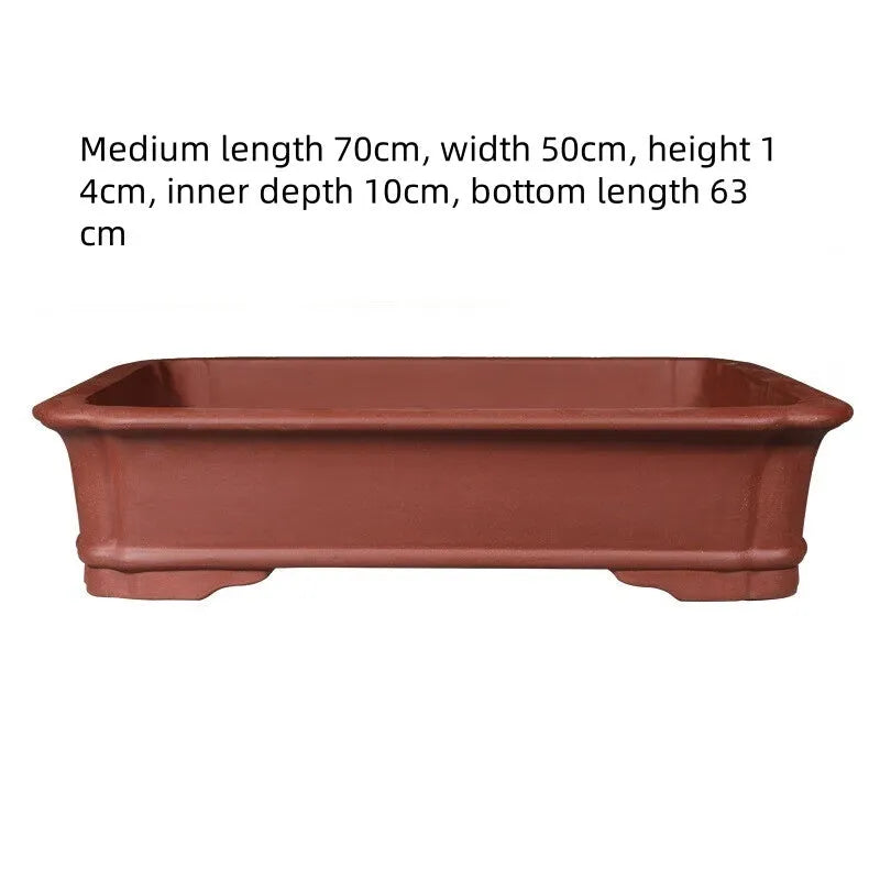 Large rectangular purple clay bonsai pot showing handmade texture and substantial size