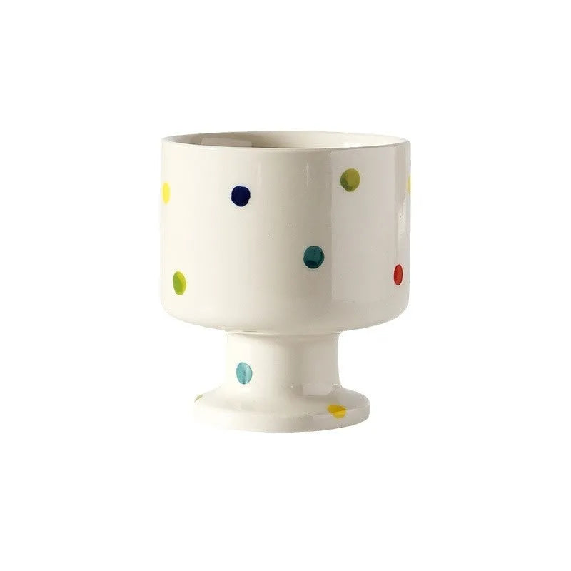 Hand-pinched irregular ceramic mug in a solid colour, showing its unique shape and modern design.