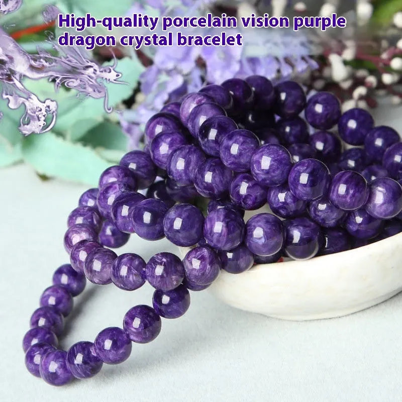Natural transparent charoite crystal bracelet with platinum on a white background, showing bead detail.