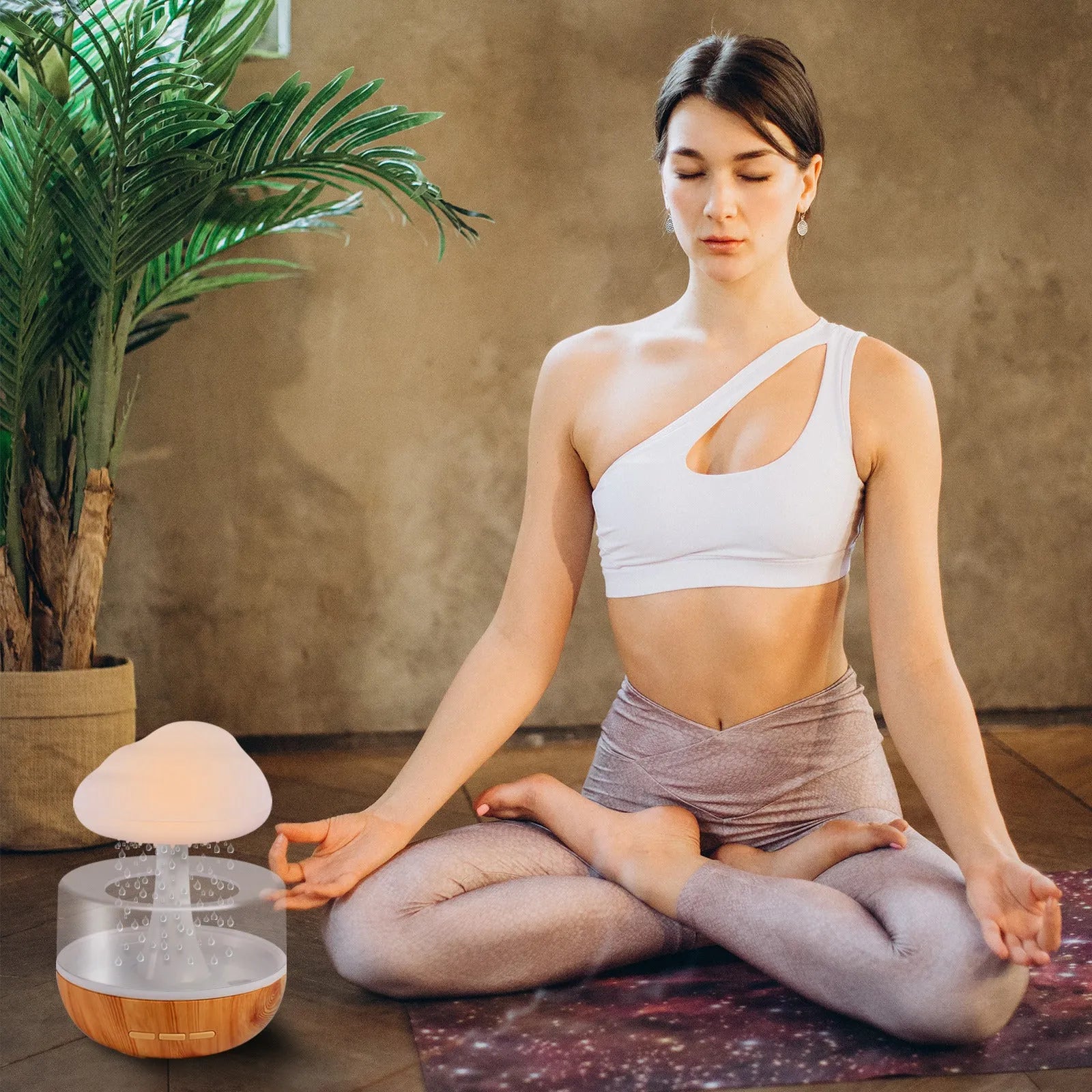 White raining cloud humidifier with essential oil diffuser and multi-colour night light on table