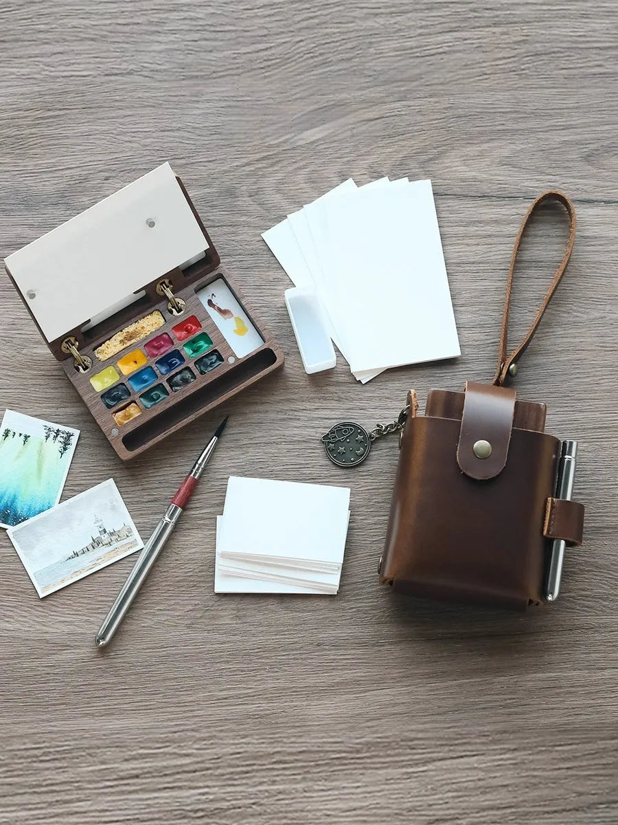 Mini walnut watercolour paint box with wooden case showing four design variants for pigment storage
