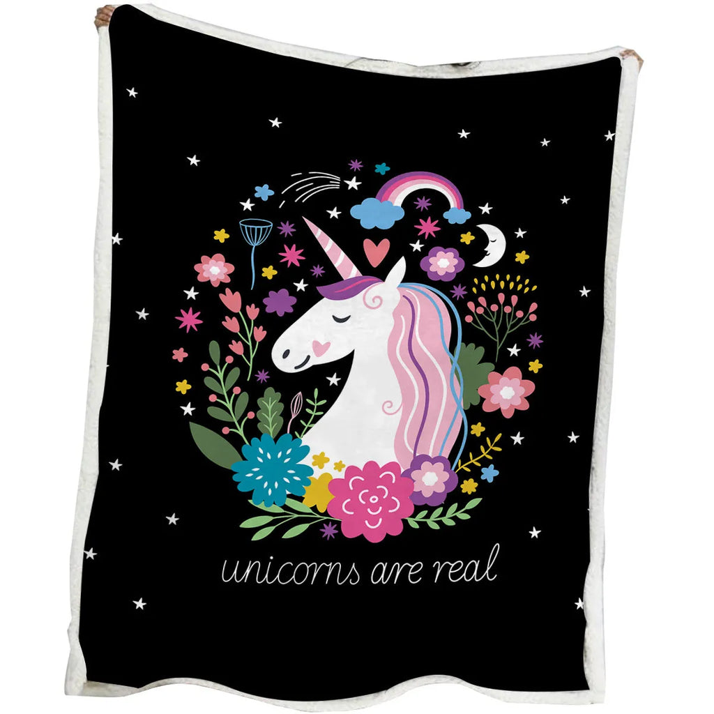 Black Sherpa fleece blanket with high weight, soft texture, and hemmed edges on a sofa
