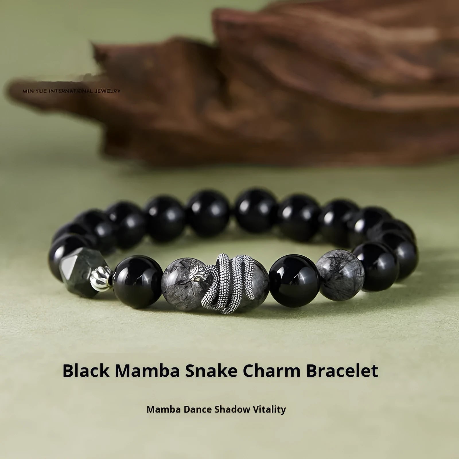 Men's S925 sterling silver bracelet with obsidian black hair crystal and detailed snake zodiac design on a black background.