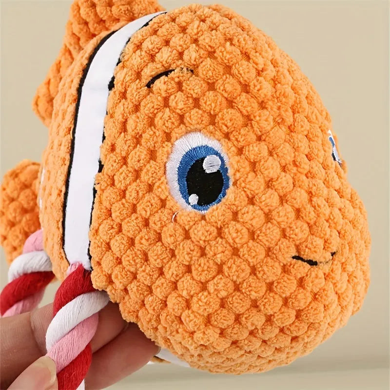 Grey turtle-shaped plush dog toy with knotted rope legs and squeaker