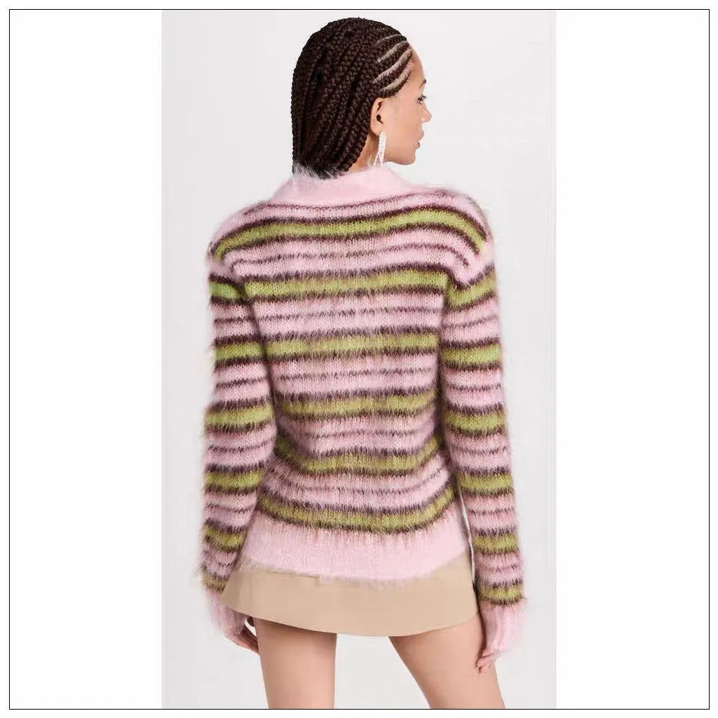 Pink wool knitted cardigan sweater on a hanger, showing round neck and cardigan style options.