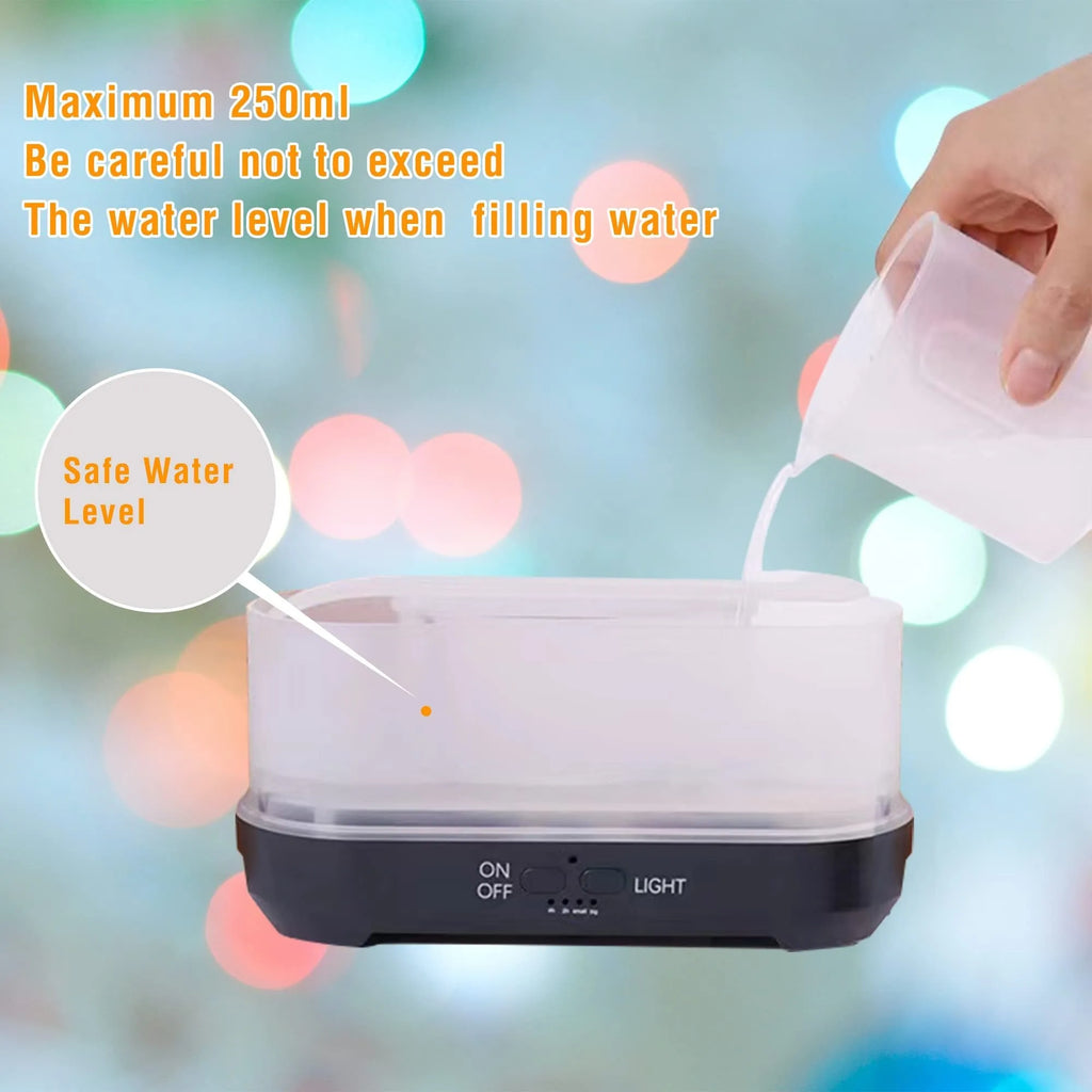Christmas snowflake pattern ultrasonic aromatherapy humidifier with colourful flame light effect on a desk.