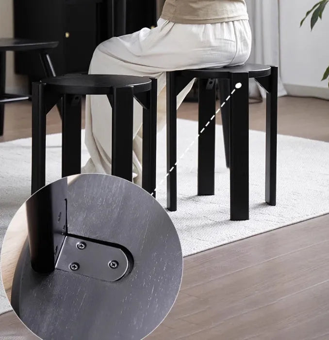 Four stackable round iron dining stools in modern design with graphic customisation options