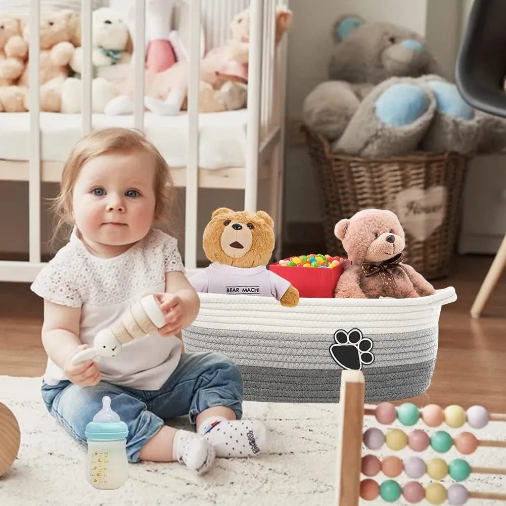 Handmade light beige woven cotton rope storage basket with a wooden handle