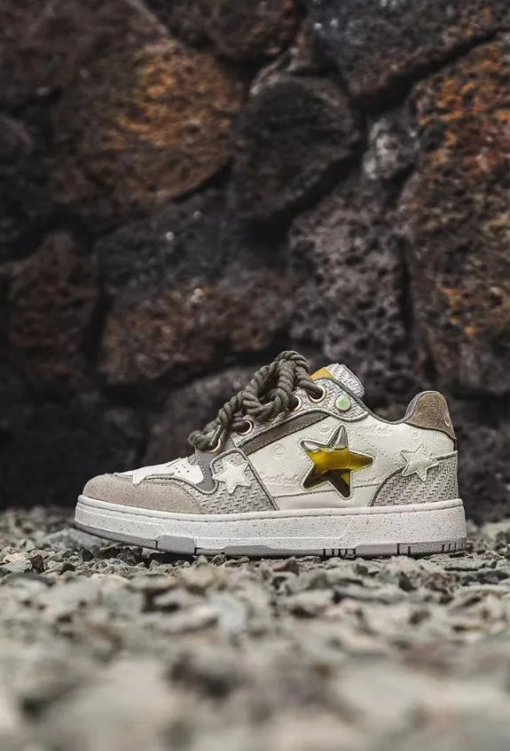 Green low top casual shoes with star pattern stitching and thick rubber soles