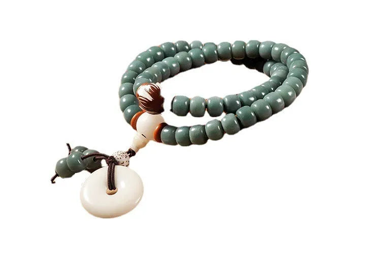 White Bodhi seed bead bracelet with metal safety buckle and lotus clasp