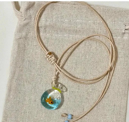 Women's pendant necklace with coloured glaze skirt joker character on a cotton linen clavicle chain.