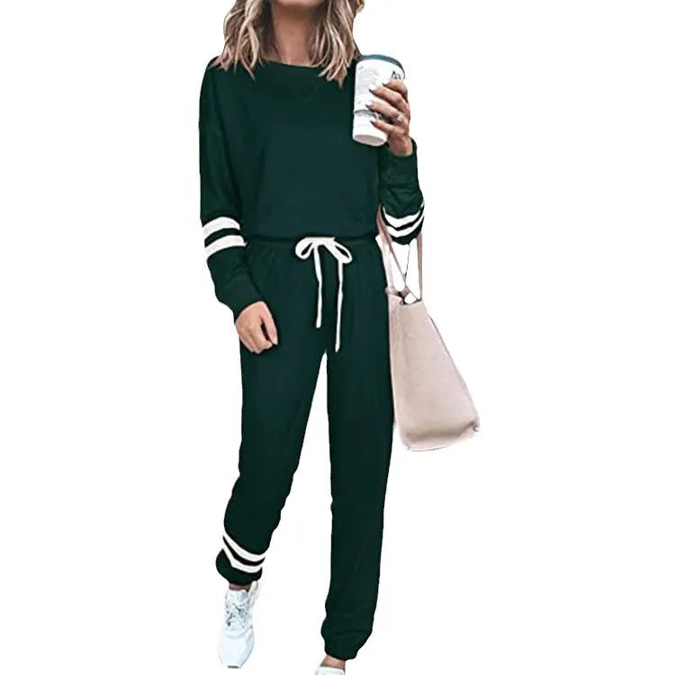 Women's loose-fitting plus size casual suit in a solid colour, featuring a half-sleeve top and trousers.