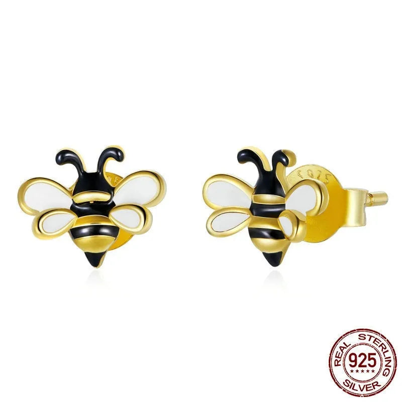 Niche Design S925 silver bee ear studs on a plain background, compact 0.7x0.8cm size
