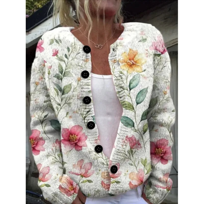 Yellow cardigan coat with a raised 3D pattern, shown on a hanger.