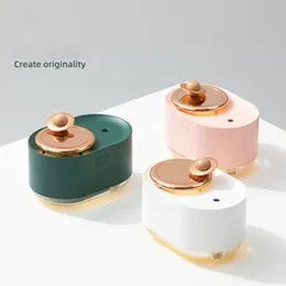 Green rotating planet-shaped USB humidifier with night light on a car dashboard