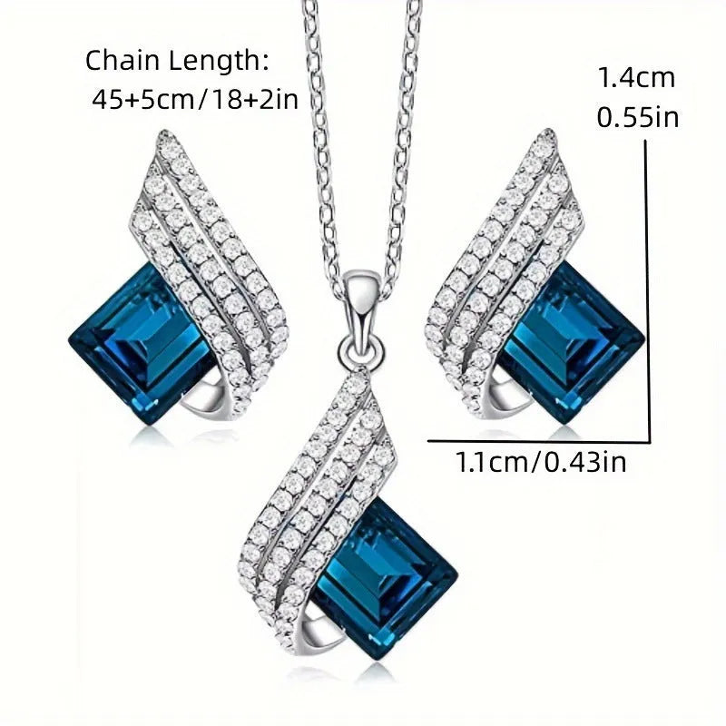 Necklace and earrings jewellery set with alloy pendant and glass details on cross chain
