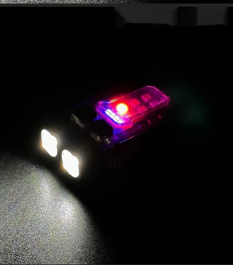 Portable red tactical warning flashlight with USB charging cable for backpack mounting.