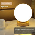 Nordic solid wood USB table lamp with touch dimming in cube style on bedside table
