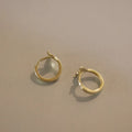 Women's sterling silver fishtail earrings in gold colour with smooth band design