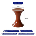 Plastic hourglass shoe changing stool in green colour showing contoured seating design