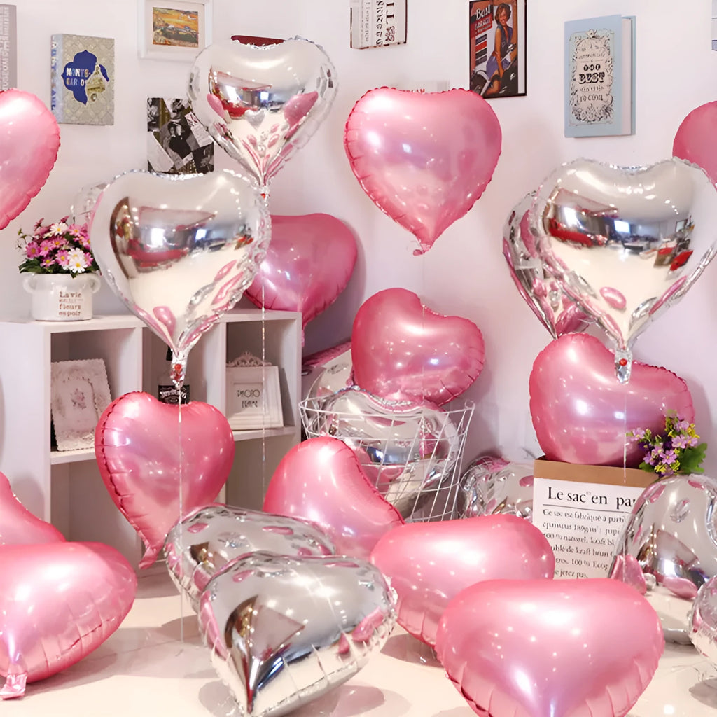 Five peach heart shaped aluminium foil balloons in assorted colours for party decorations