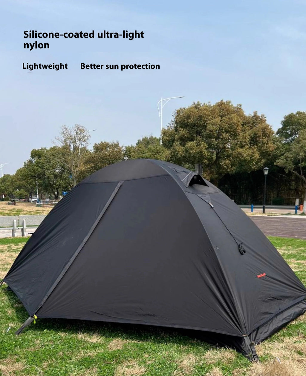 Single person double skin tent with aluminium poles in a red colour option, shown erected.