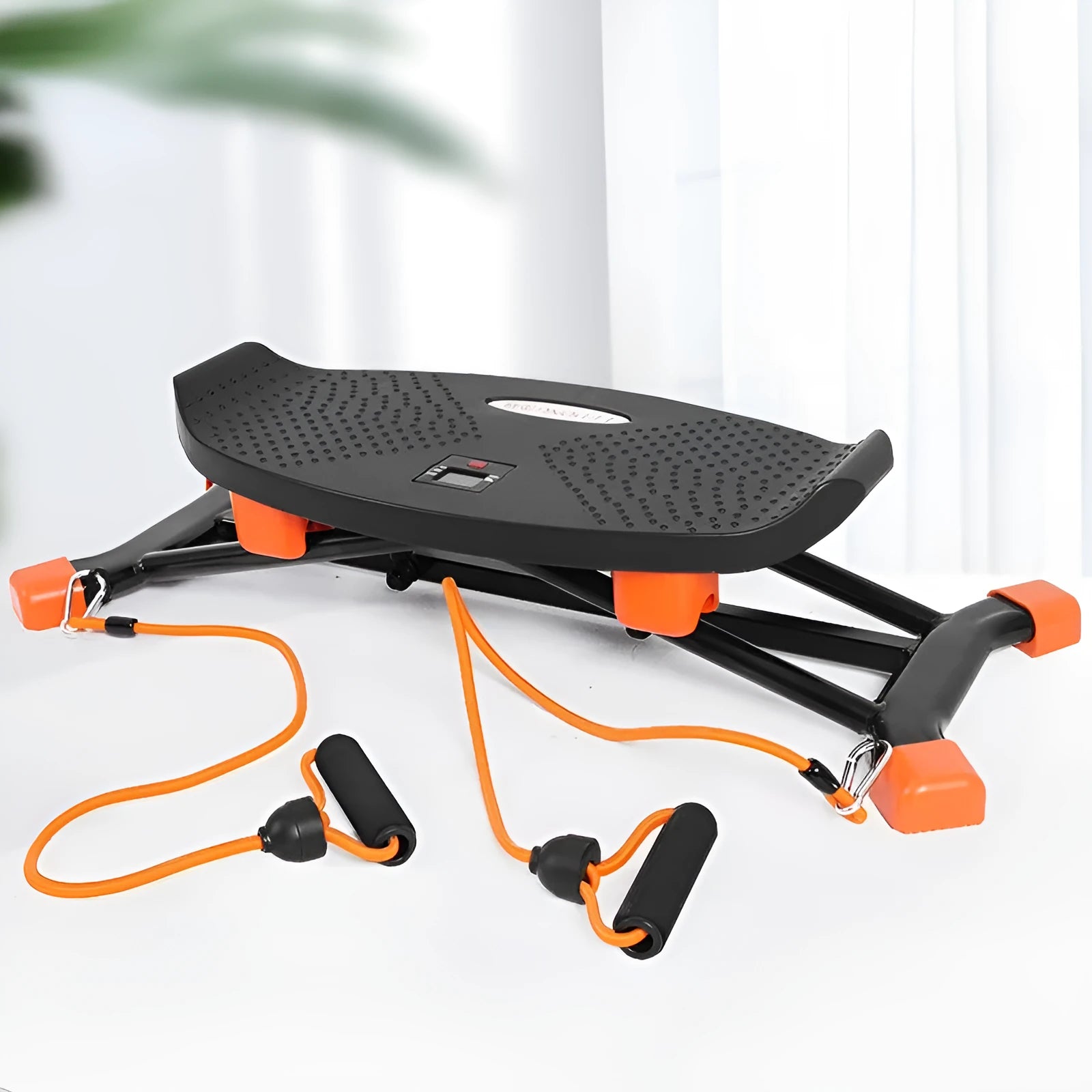 Black foldable mini fitness skiing machine JS101A with elastic hand straps on a home floor.