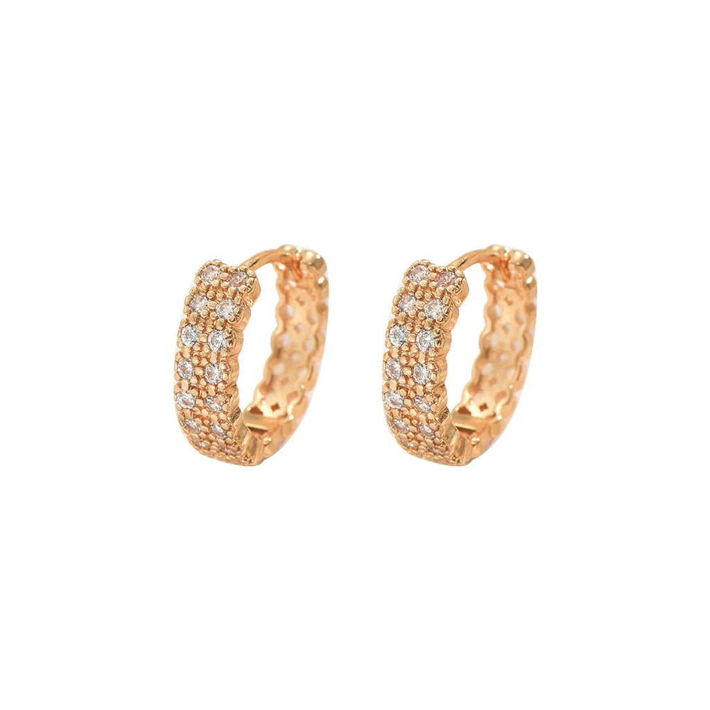 A pair of women's geometric pattern copper ear studs with round, dot, and ring details.
