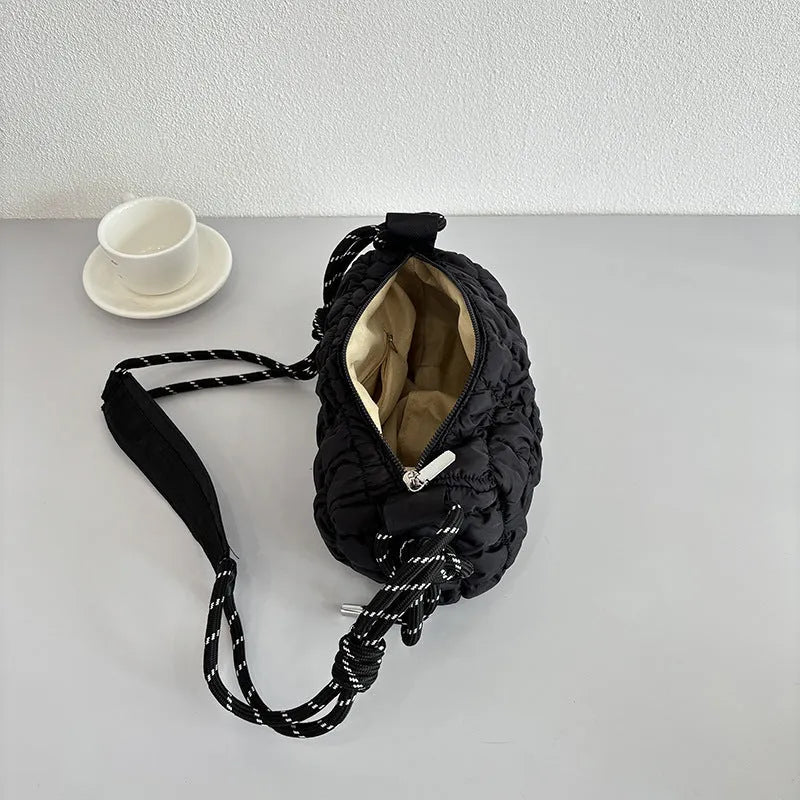 Soft nylon women's crossbody messenger bag in pillow shape with a rhombus pattern and a zippered inner pocket.