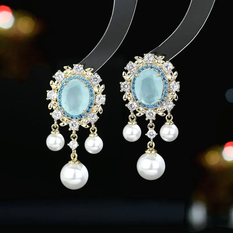 Oval geometric earrings with zircon inlay and pearl tassels in pink, blue, purple, and white colour options