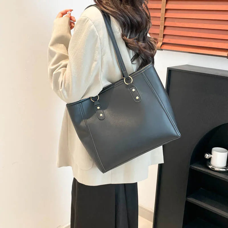 PU leather tote bag in urban simplicity style with internal organisation pockets