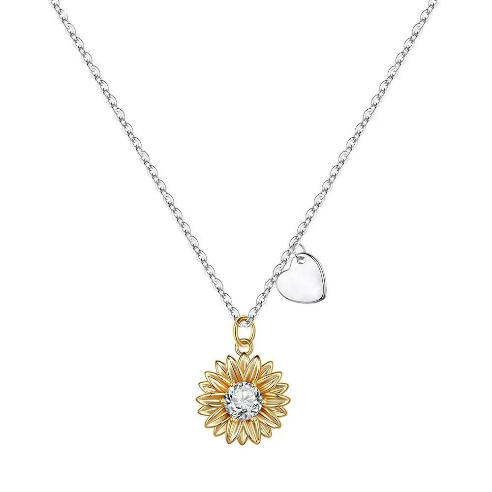 Women's sterling silver sunflower necklace with geometric petal pendant on a cross chain.