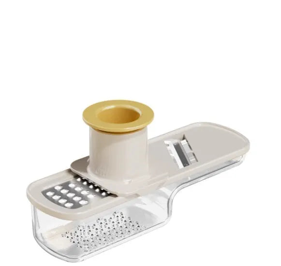 Stainless steel ginger and garlic grinder three-in-one potato slicer in beige on kitchen counter