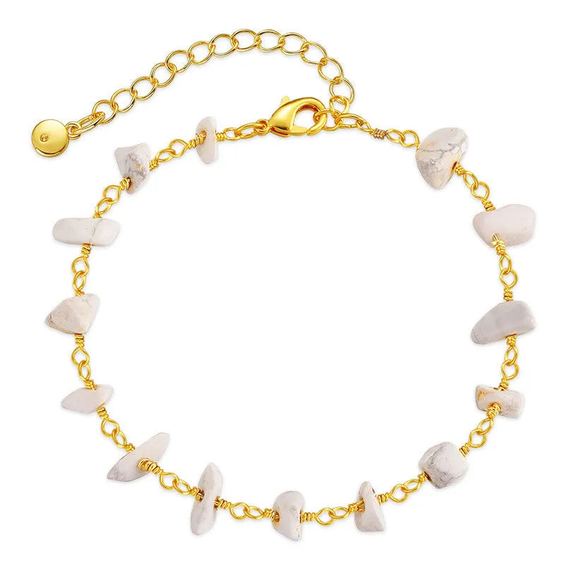 Women's geometric turquoise bracelet with irregular natural gravel stones and crystal accents on gold-plated copper