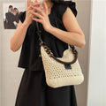 Knitted bucket tote beach bag with contrast stitching and zippered interior compartment