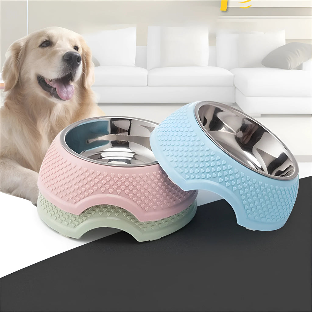 Blue stainless steel pet bowl with non-slip base for cats and dogs on a kitchen floor.