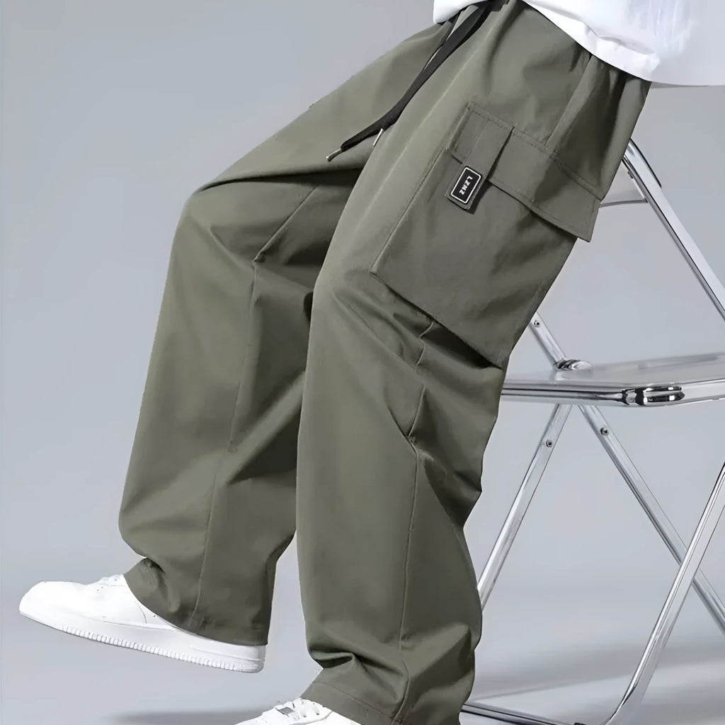 Boys straight leg cargo pants with drawstring waist and large side pockets in polyester fabric