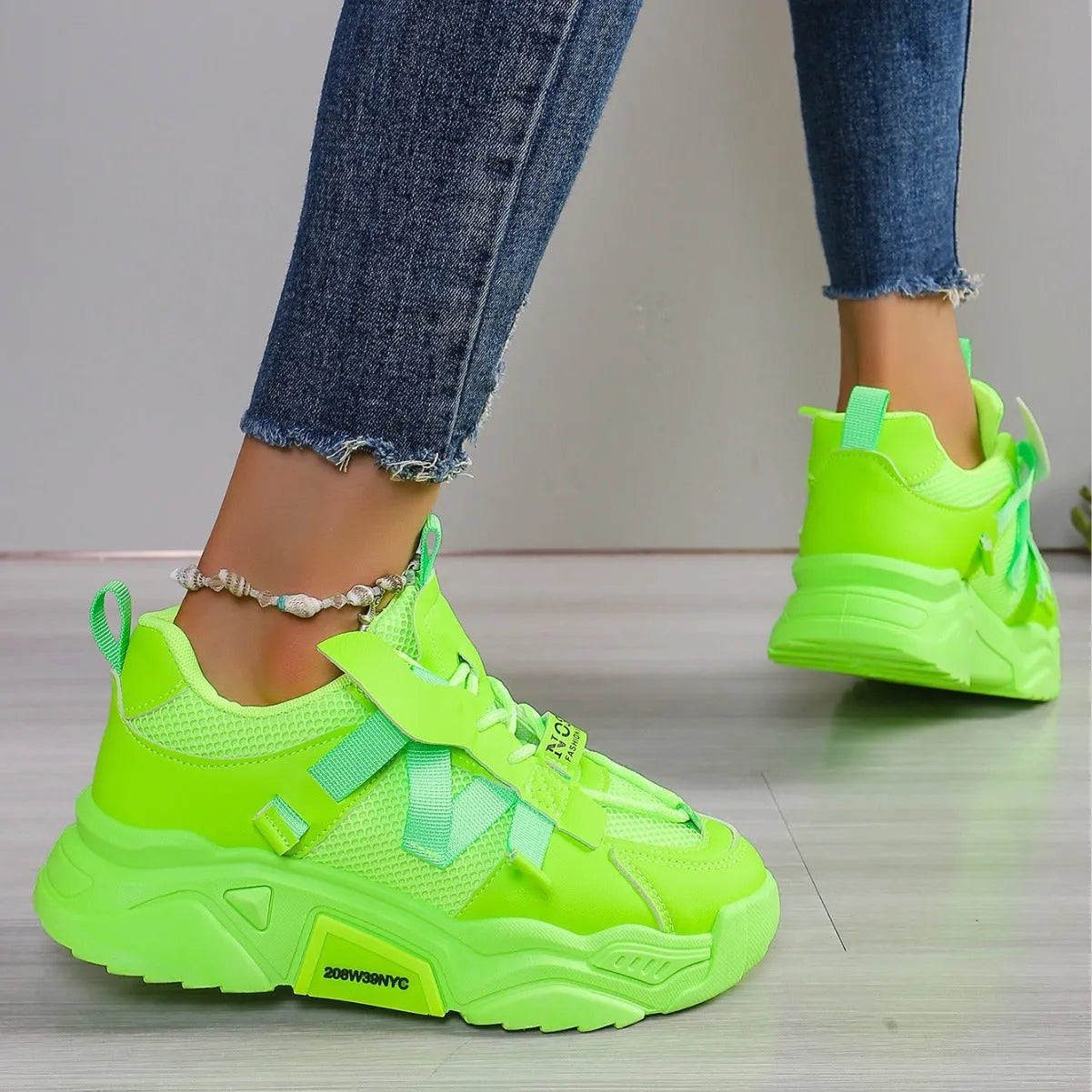 Women's purple platform mesh sneakers with lace-up front on wooden floor