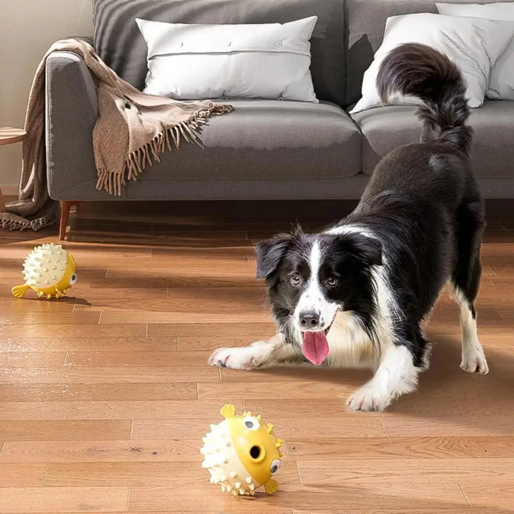 Yellow vinyl fish-shaped dog chew toy with textured surface for aggressive chewers