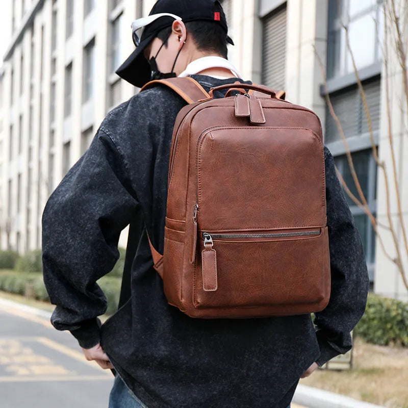 Men's vintage PU leather backpack in gray, 20-35L, with air cushion belt and patchwork accent