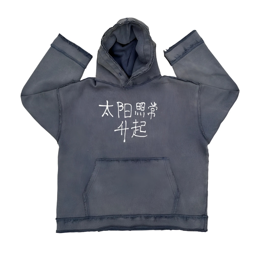 Dark blue hooded sweater with 'The Sun Also Rises' text printed on the back.