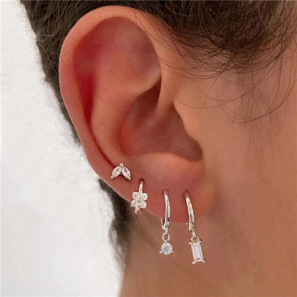 Four pairs of geometric copper earrings with zircon detailing in gold or silver electroplated finish