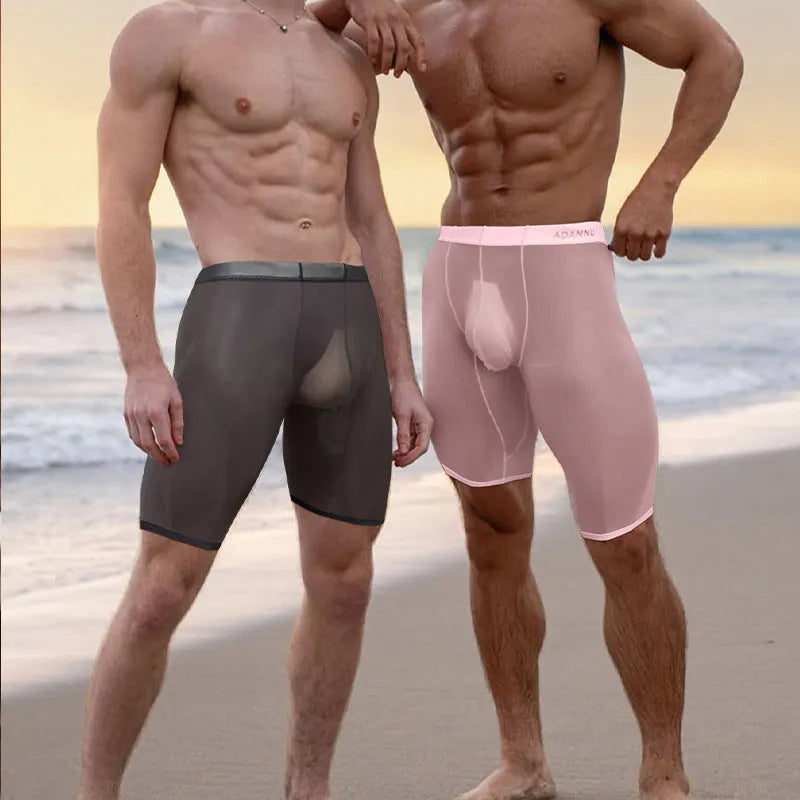 Men's black knitted nylon mesh home shorts on a hanger, showing seamless design.