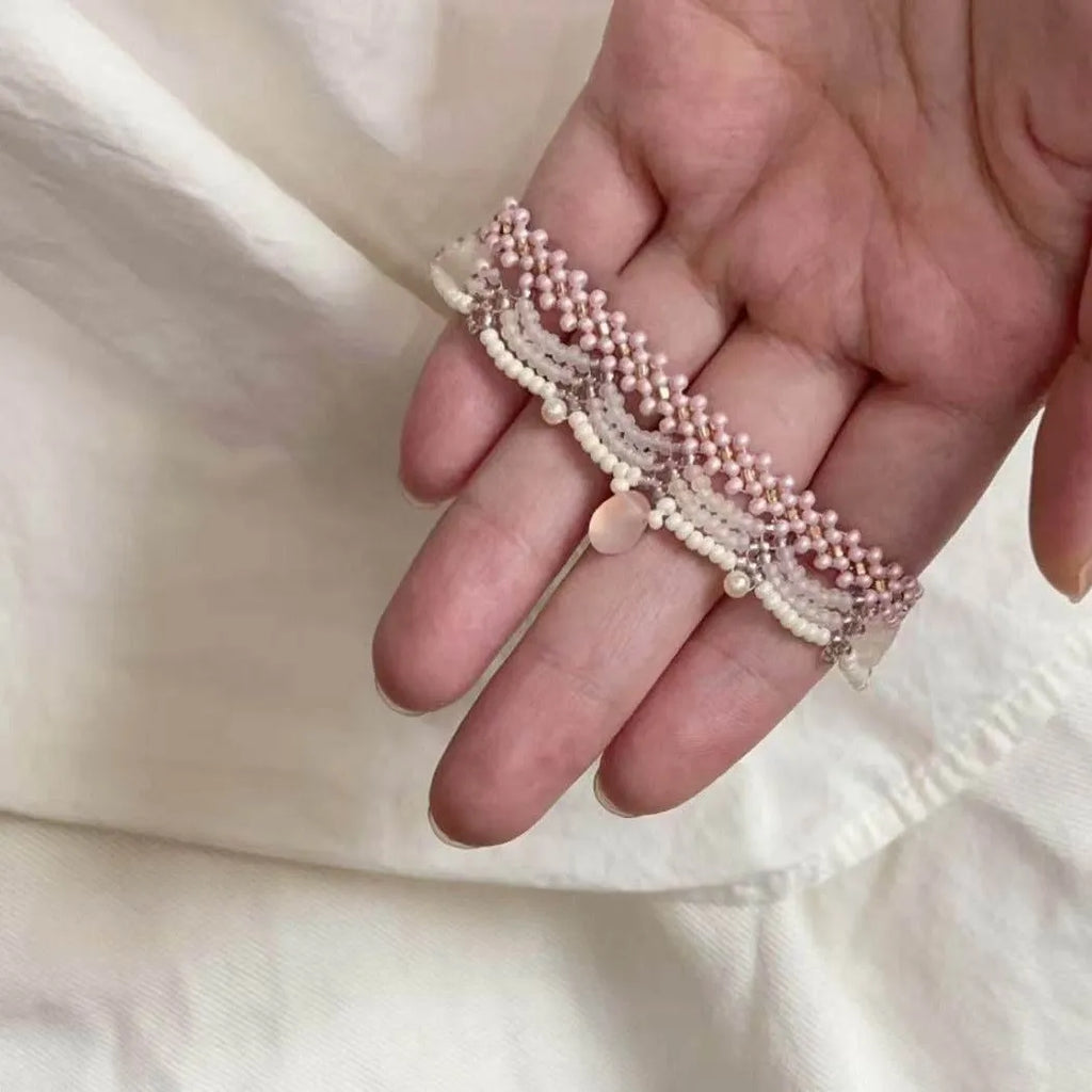 Hand-woven glass beaded wave necklace in pink with alloy pendant and matching bracelet