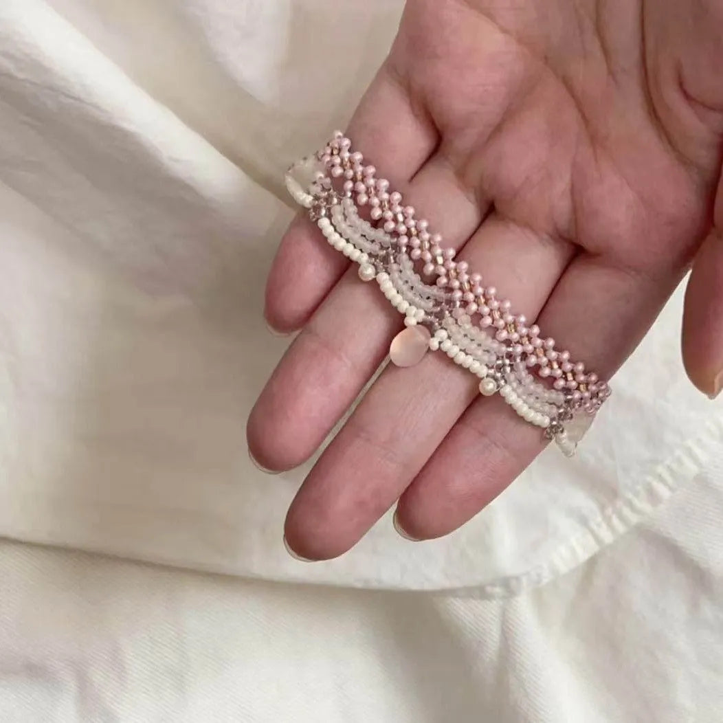 Hand-woven glass beaded wave necklace in pink with alloy pendant and matching bracelet