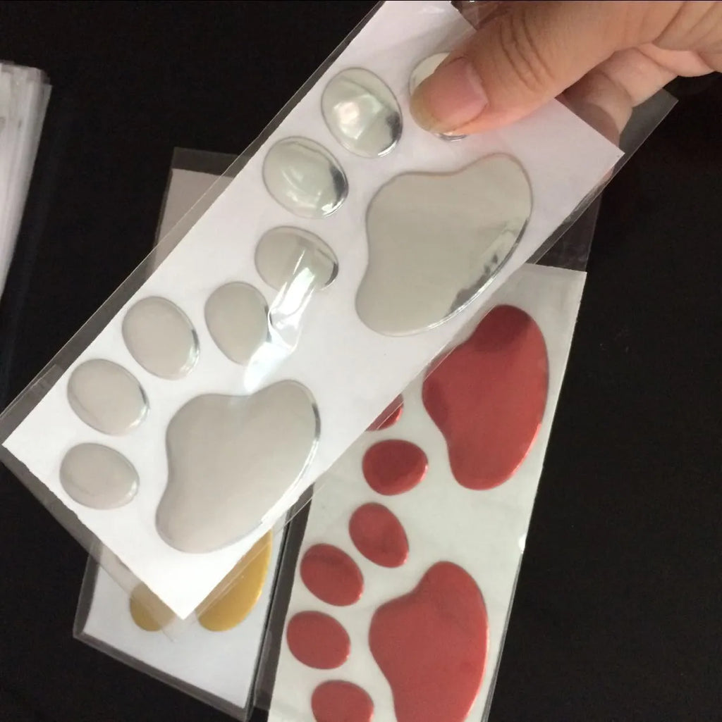 PVC car sticker with hand-shaped brush design showing footprint pattern for bumper scratch coverage